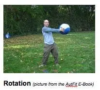 Man in casual clothes holds a large blue and white ball in front of him.