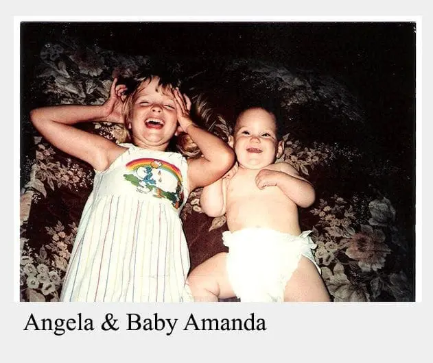 Angela and Baby Amanda smile happily at the camera.