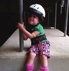 Ines Mitsouras wearing a helmet and holding a pole.