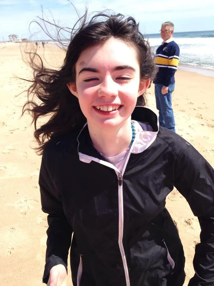Maria Bucchino smiling on a beach.