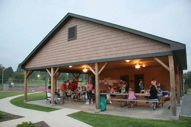 Barren Heights Retreat pavilion with people dining at picnic tables.