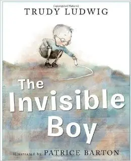 The Invisible Boy book cover illustration featuring a boy drawing a line on the ground.