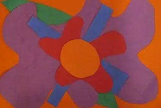 Paper collage of a large, stylized red and purple flower with a yellow center on an orange background.