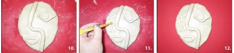 Clay abstract face design is etched and a clay coil is applied.