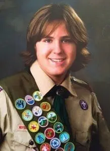 Boy Scout Patrick smiling.