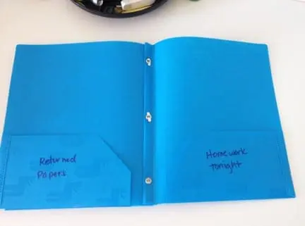 Blue two-pocket folder with "Returned Papers" on the left and "Homework Tonight" on the right.