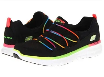 A pair of black Skechers slip-on shoes with rainbow accents and white soles.