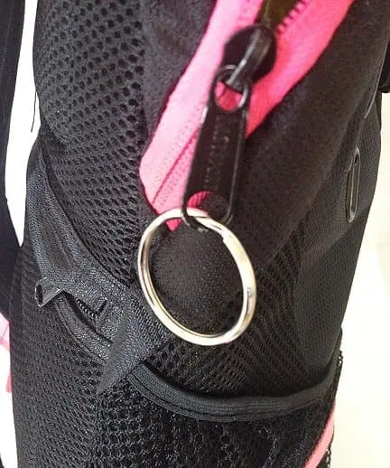 Zipper pull with a key ring attached to a backpack.