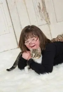 Jaycee hugging her cat Anna