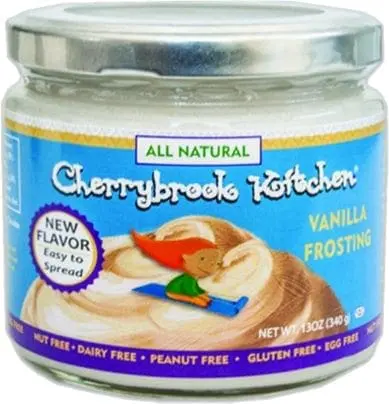 Jar of Cherrybrook Kitchen Vanilla Frosting with "All Natural" and "New Flavor Easy to Spread" labels.