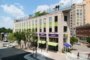 Edventure Children's Museum building with purple signage and green awnings.