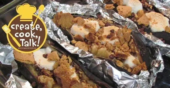 Campfire banana boats made with banana, marshmallows, and graham cracker crumbs in foil.