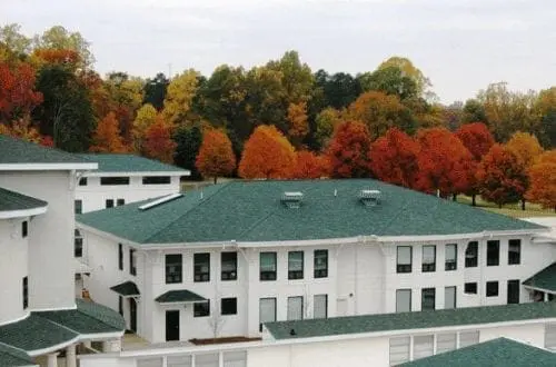 Triad Academy buildings surrounded by autumn foliage.