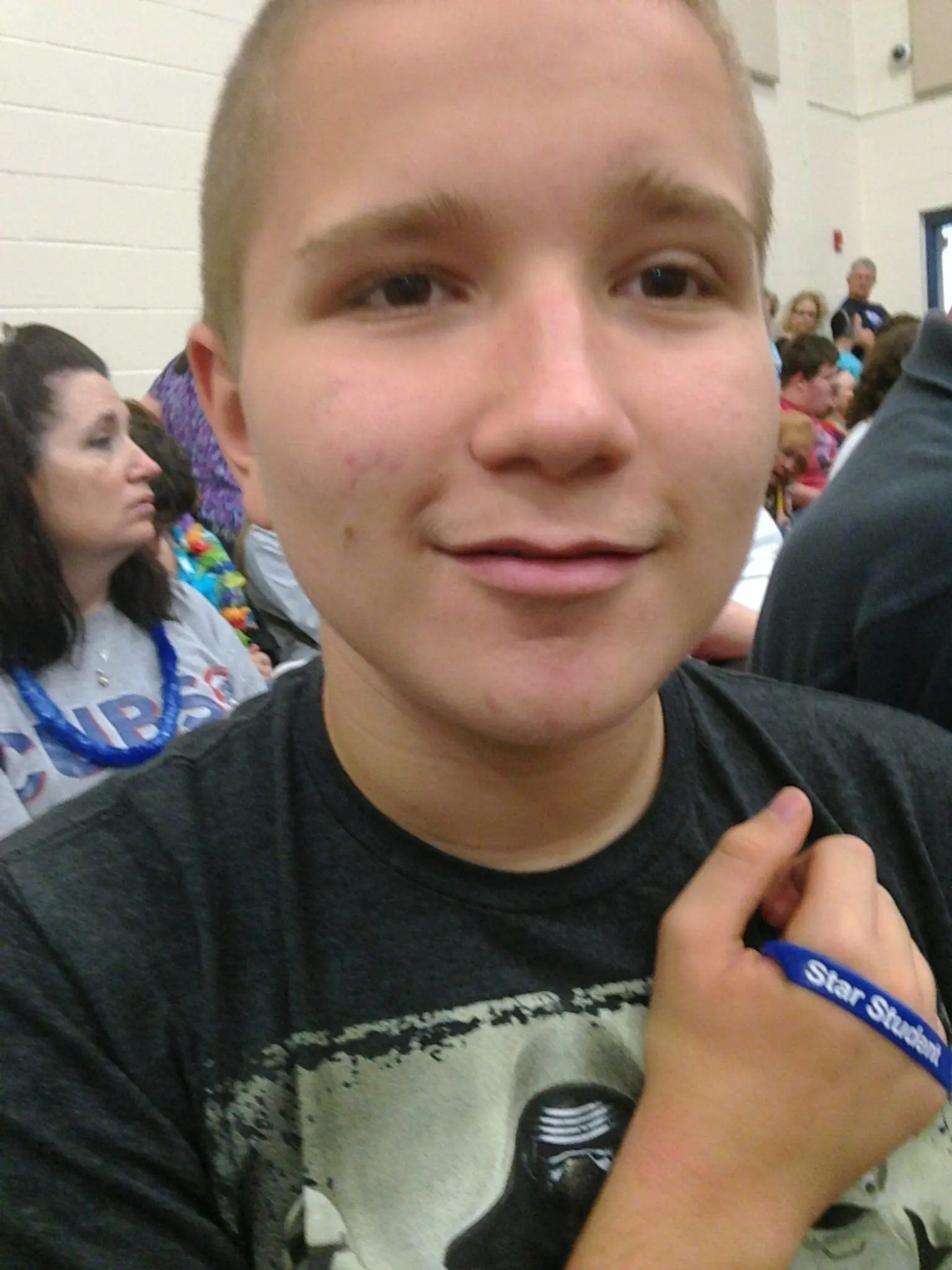 Richie wearing a "Star Student" bracelet.
