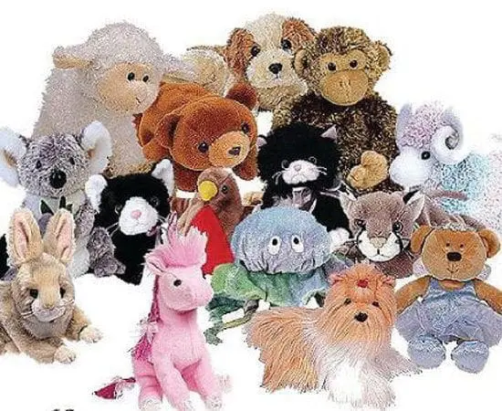 A collection of stuffed animals, including bears, a unicorn, a dog, a rabbit, and a sheep.