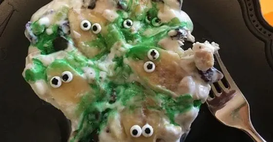 Spooktacular BOO BARK breakfast yogurt with candy eyes and green drizzle