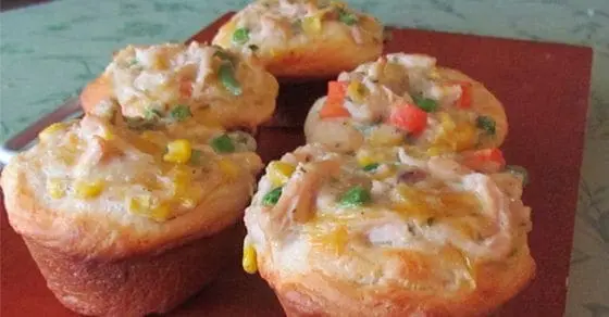 Chicken pot pie cupcakes filled with chicken, vegetables, and cheese.