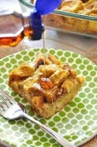 Pumpkin French Toast Bake on a green polka dot plate with syrup being poured.