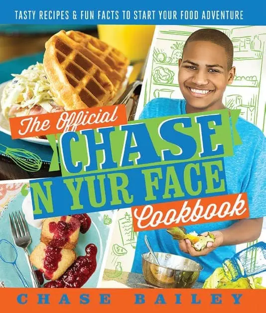 Chase Bailey smiles next to a waffle and a plate of food.