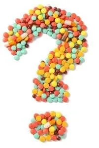 A question mark made of colorful pills.