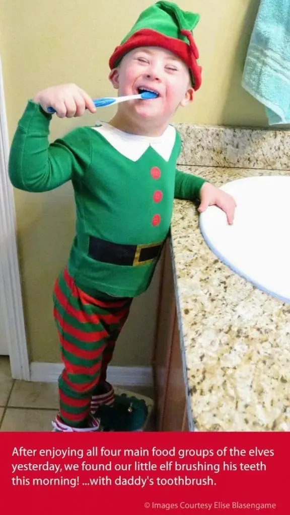 S.J. dressed as an elf brushing his teeth.