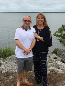 Michael and Robin standing by the water.