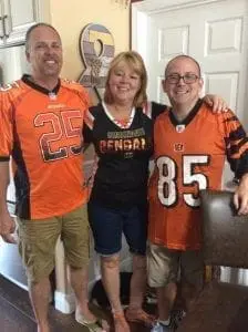 Robin Raiff and two other people wearing Cincinnati Bengals jerseys.