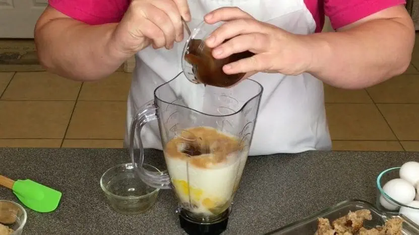 Adding ingredients to a blender for Peanut & Apple Butter French Toast Bake.