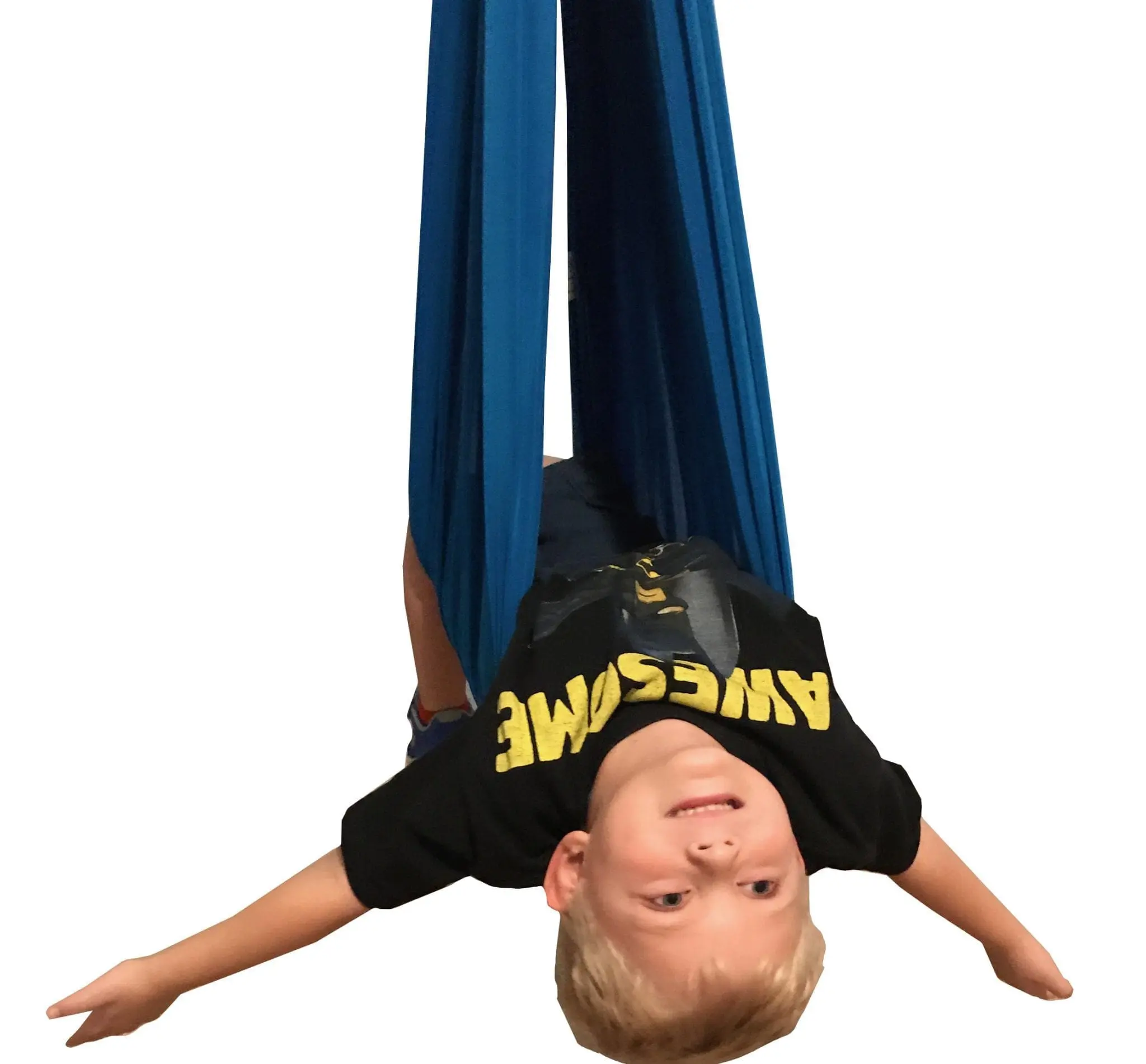 Boy in a blue sensory swing wearing a black t-shirt with "AWESOME" written on it.