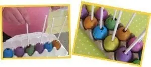 Colorful egg-sicles on sticks in an egg carton, with a hand inserting a stick into one.