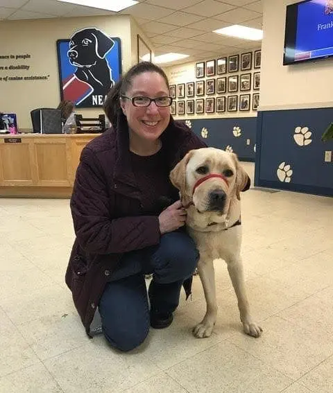 TS with Monty, a yellow Labrador Retriever.