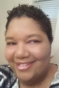 Monique Duell smiling.