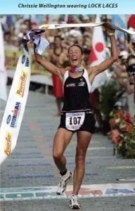 Chrissie Wellington wearing LOCK LACES while crossing a finish line.