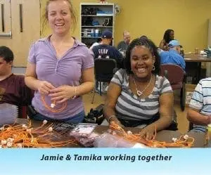 Jamie and Tamika smiling while working together.
