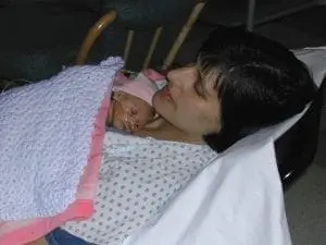 Deb Discenza holding her infant daughter.