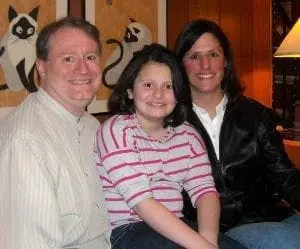Deb Discenza and her family smile for a photo.