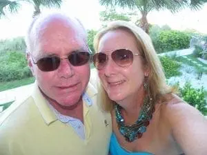 Man and woman wearing sunglasses outdoors.