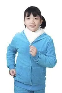 A girl wearing a blue hoodie and scarf running.