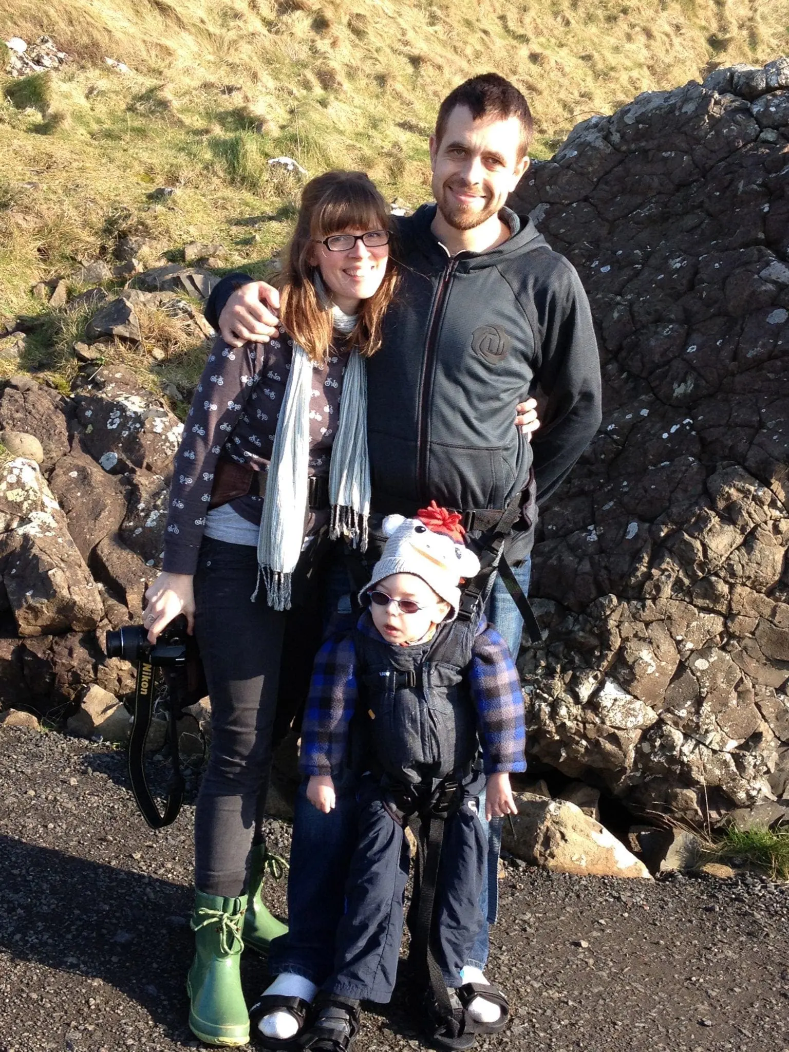 Kara, Ali, and Sebastian standing together on the Giants Causeway.