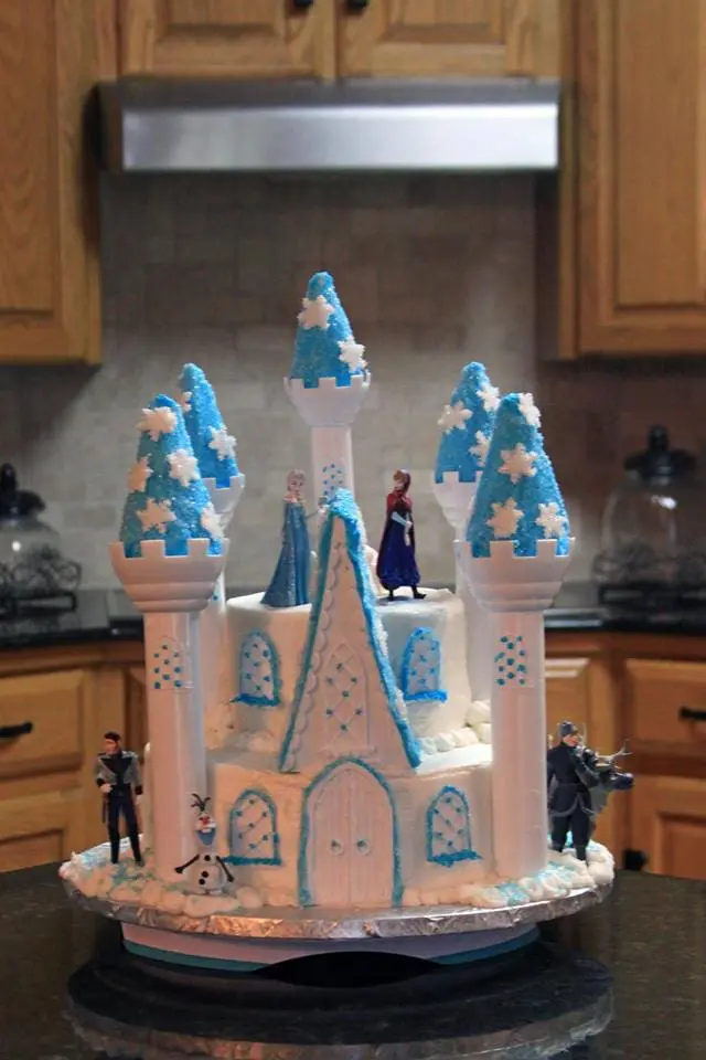 Elsa castle cake with figurines.