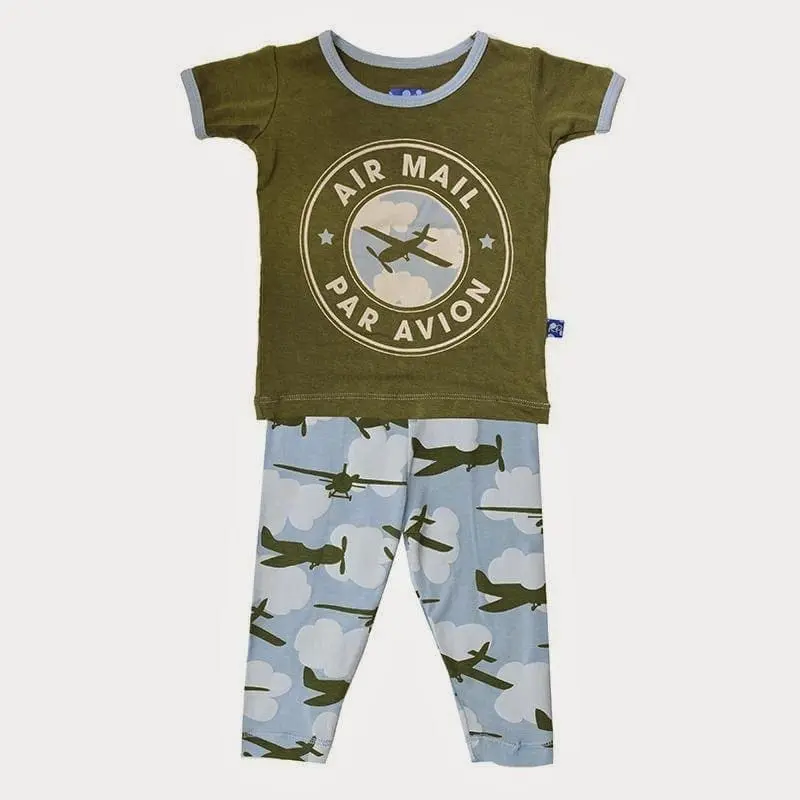 Olive green pajamas with an "Air Mail" graphic on the shirt and airplane pattern on the pants.