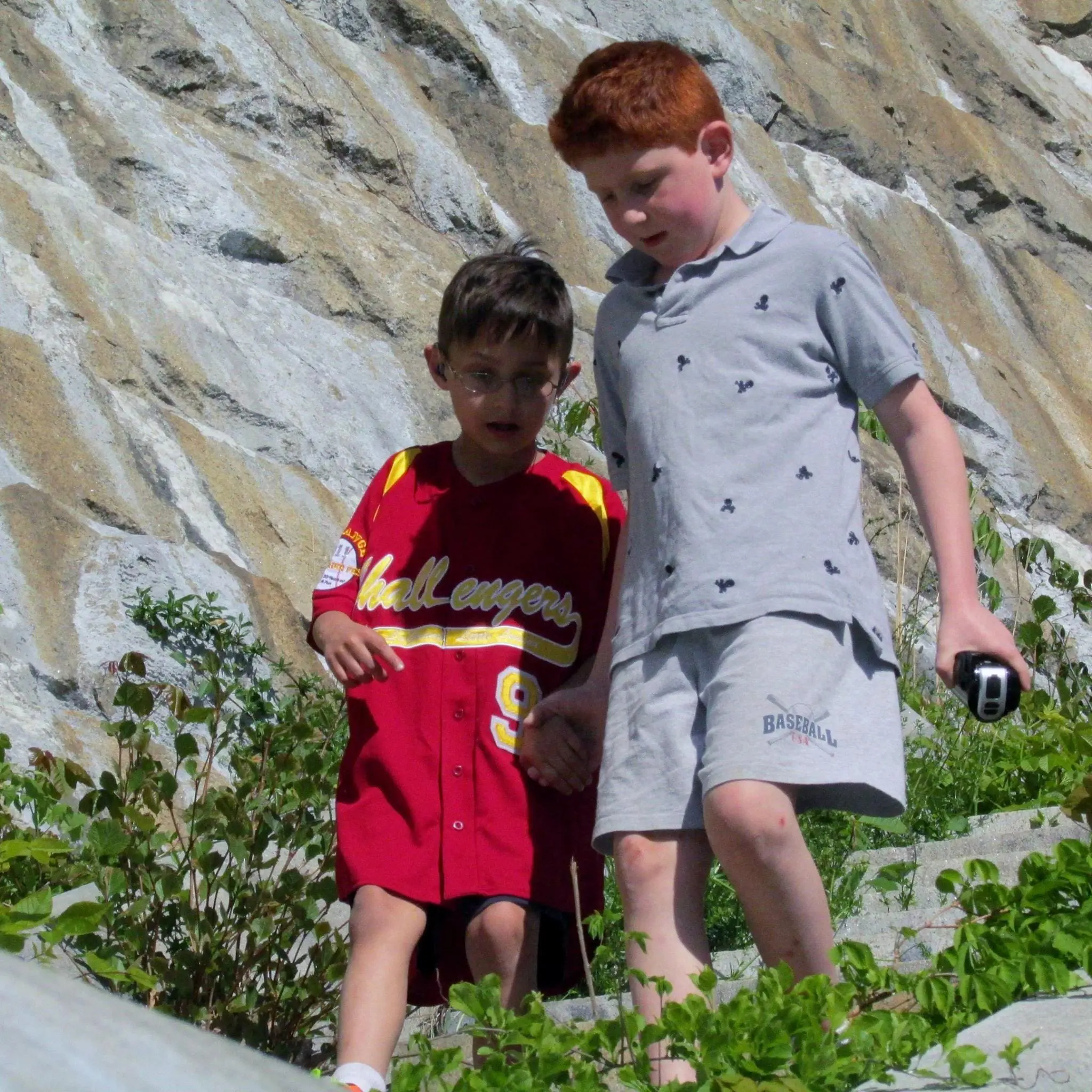 Vincent and Dominick walking together outside.