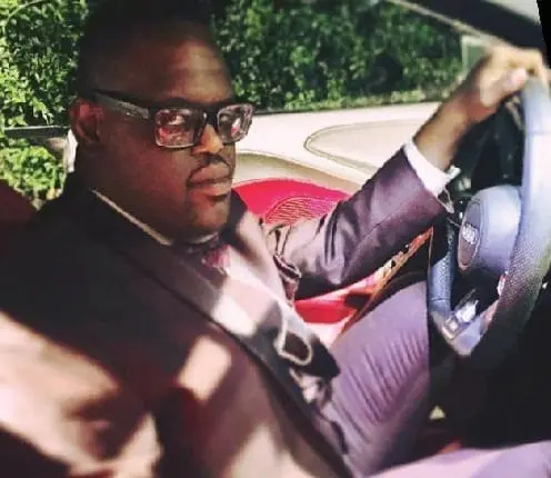 John Tucker driving a car.