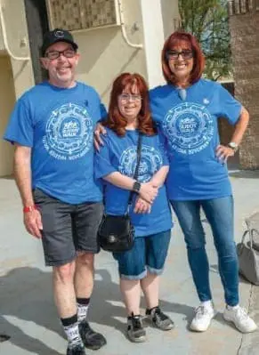 Rachel Osterbach Family wearing matching blue t-shirts.