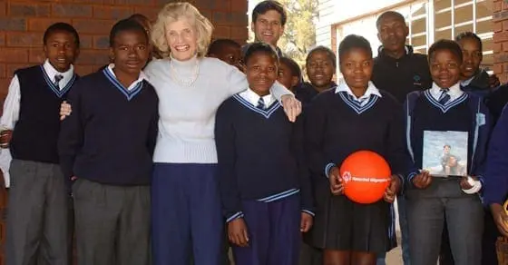 Eunice Kennedy Shriver poses with a group of students.
