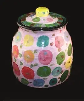 Ceramic jar with a lid, painted with colorful circles and dots.