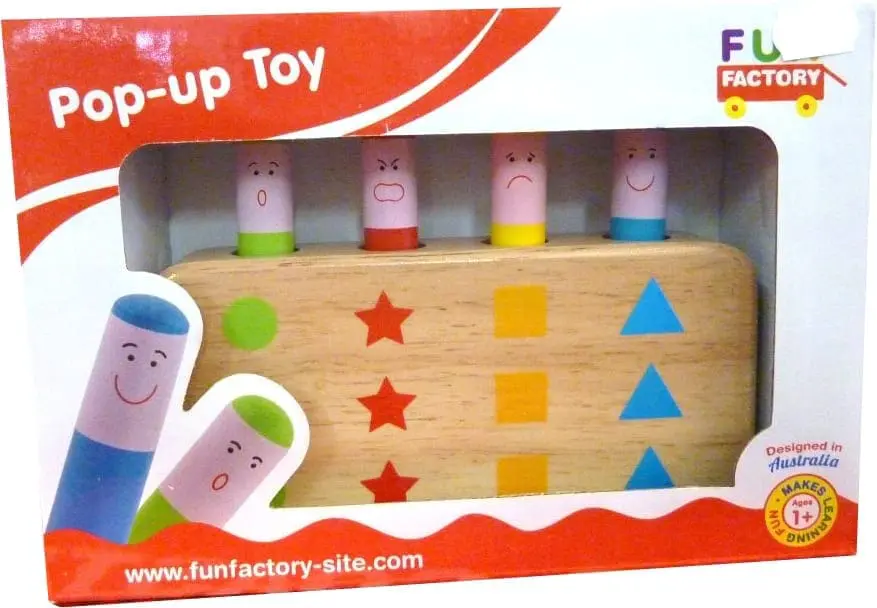 Wooden pop-up toy with colorful pegs and shapes.