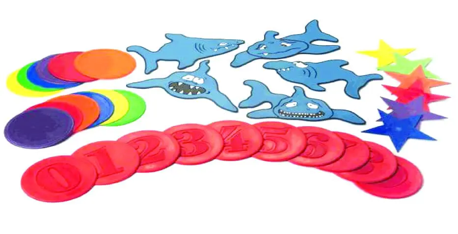 Shark-shaped counters, colorful discs, and star-shaped counters.