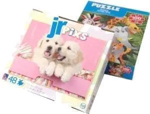 Boxes of Jr. Pixs and Puzzle brand jigsaw puzzles.