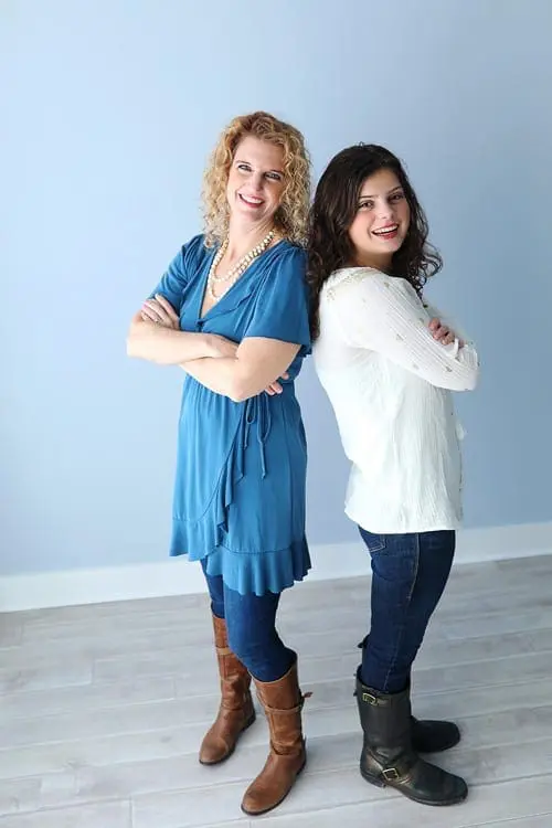 Julie Hornok and daughter standing with arms crossed.
